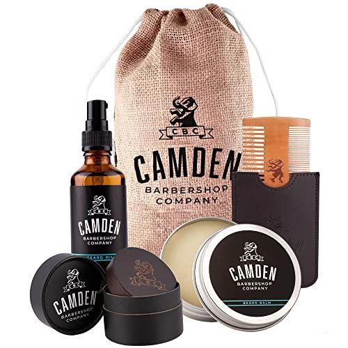 Kit de soins pour barbe avec huile hydratante, brosse en noyer, peigne, cire parfumée, ingrédients naturels et e-book d'astuces pour barbes impeccables.