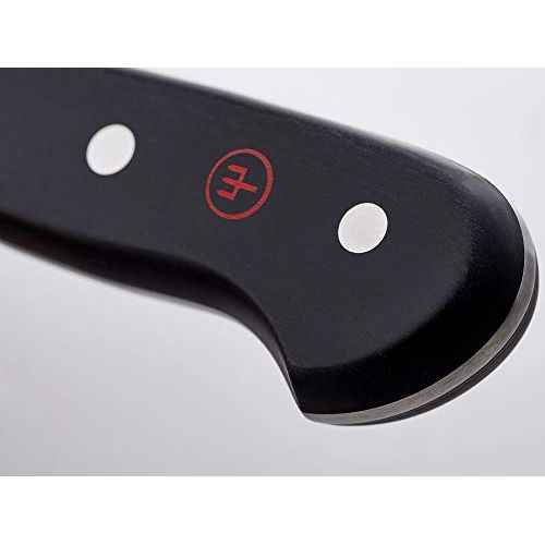 Couteau de chef Wüsthof professionnel, lame en acier carbone, tranchant PEtec, pour cuisine gastronomique et découpe précise.