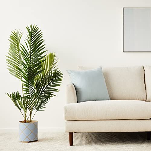 Plante verte artificielle tropicale en pot, 1m20, larges feuilles ajourées, décoration intérieure, sans entretien, idéale pour maison ou bureau.