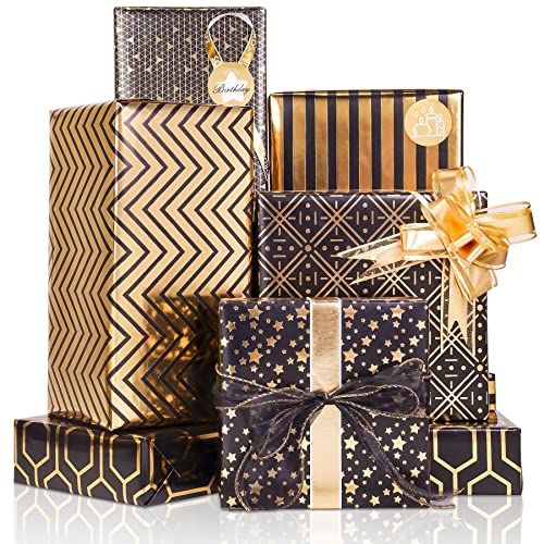 Kit papier cadeau métallique avec feuilles brillantes, noeuds dorés et autocollants pour emballages festifs.
