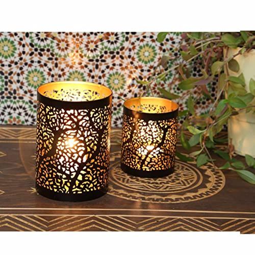 Photophore d'ambiance en métal ciselé, motifs créant des jeux d'ombre et de lumière, design estampillé Paisley.
