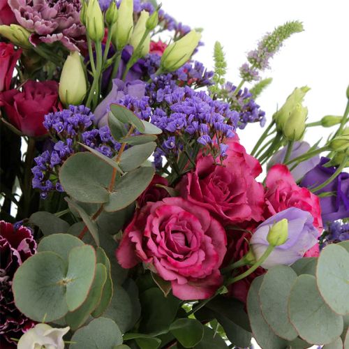 Bouquet Empereur majestueux en roses, lisianthus et œillets violets et roses